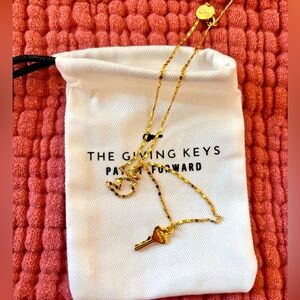 NWOT The Giving Keys mini Strength necklace in gold tone